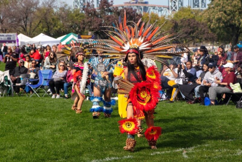 Native American Day girl wearing native red costume
