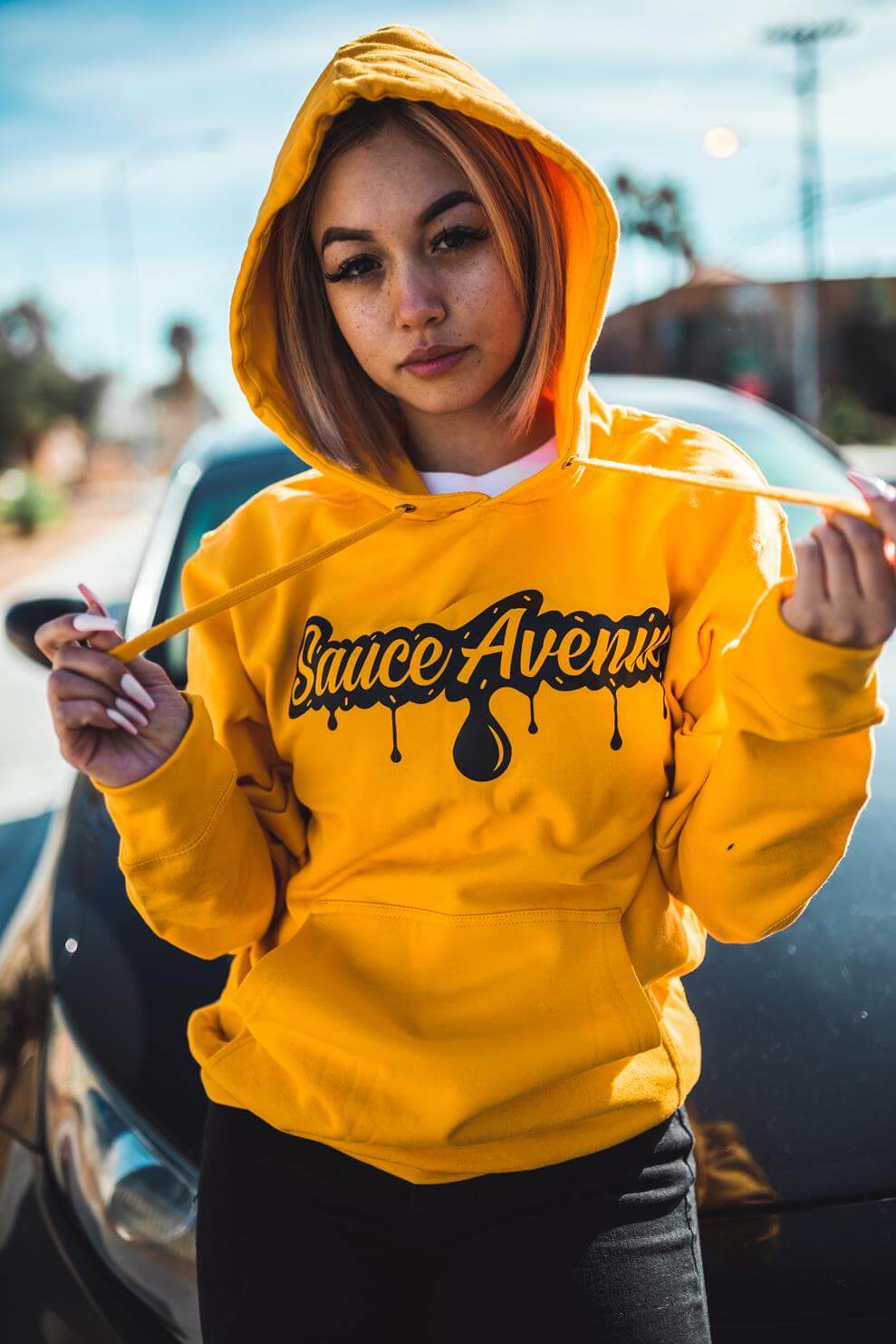 A mustard hoodie is the perfect choice for fall festival