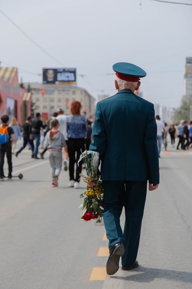 An old soldier celebrate Veteran Day with roses